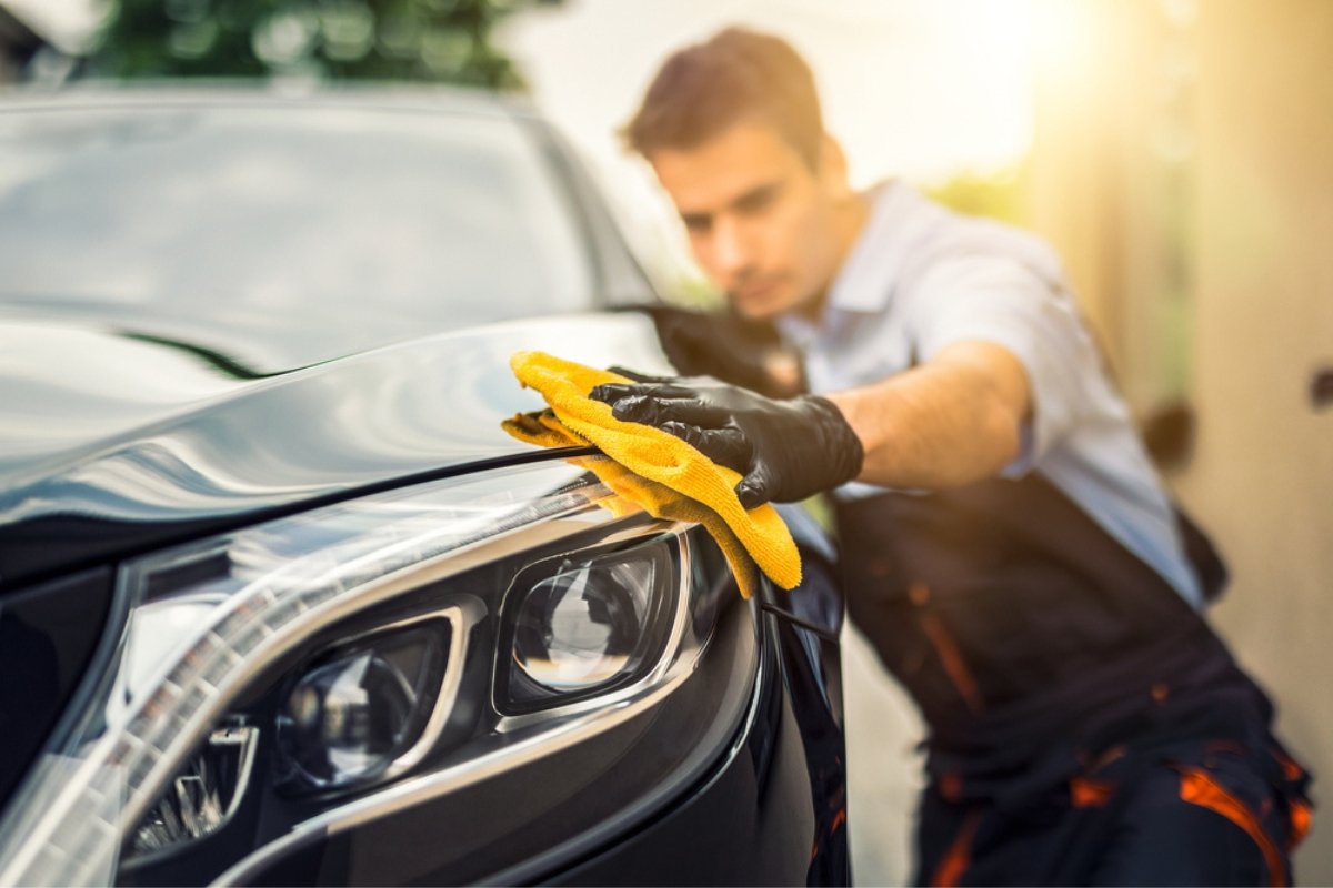 Detailing and resale value a man carrying out careful exterior detailing